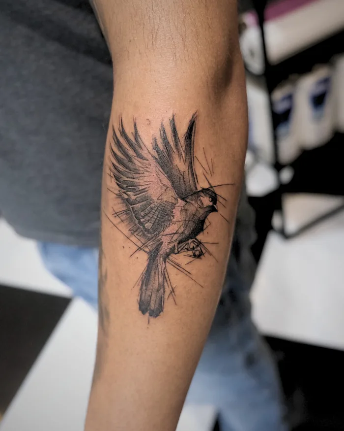 Black bird tattoo